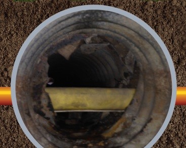 Photo #1a: Crossbore: Punching through an existing pipe while installing a new utility, using horizontal directional drilling.